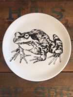 Frog plate showing frog in black drawn against white plate