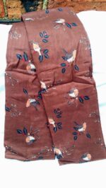 browny purple scarf with robins on it lying on a white background