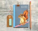 small notebook with a squirrel on the front, plus a pencil and eraser