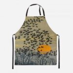 starlings apron showing birds flying against a summer sunset sky