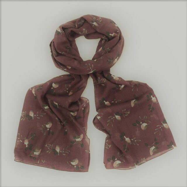 browny purple scarf with robins on it lying on a white background