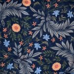 close up of dark blue fabric with flowers and leaves