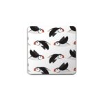 puffin circus coasters shows black and white birds with red beaks flying sideways