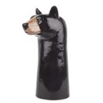 black bear vase by quail ceramics shows tall black vase with bear's head facing sideways