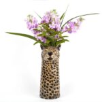 leopard vase by quail ceramics shows the spotty vase with leopard's head and mauve flowers