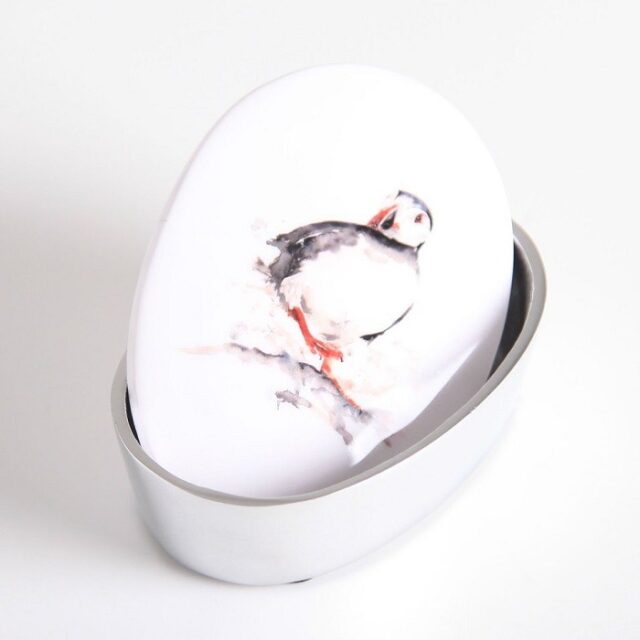 puffin trinket box shows the box with lid ajar, decorated with a drawing of a puffin