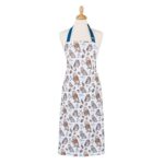 owls apron shows repeat pattern of owls and dark blue neck tie