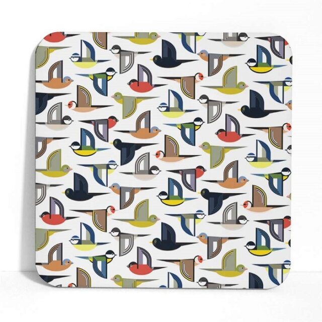 Flock placemats shows stylised birds in a multi coloured repeat pattern