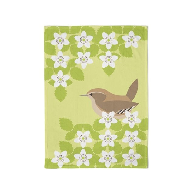 Small brown bird against green background with blossom