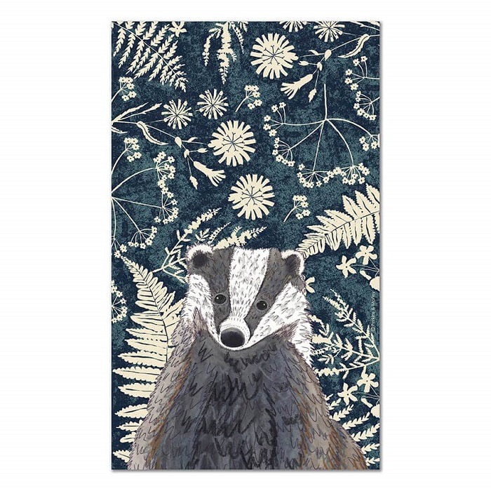 black and white badger against blue and white background