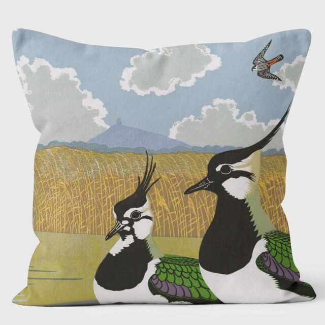 Image of a cushion with lapwings in the foreground, a cornfield behind and a falcon in the sky Ducks Lapwings Falcons II