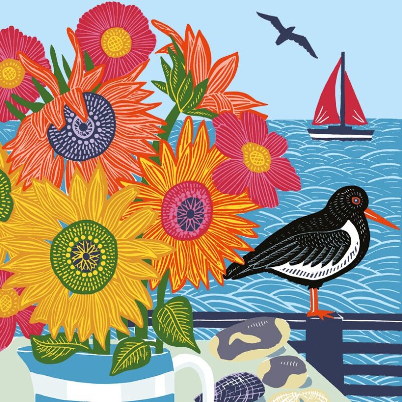 Oystercatcher and sunflowers greetings card shows a large colourful bunch of sunflowers in a jug with a black and white bird and a blue seascape behind