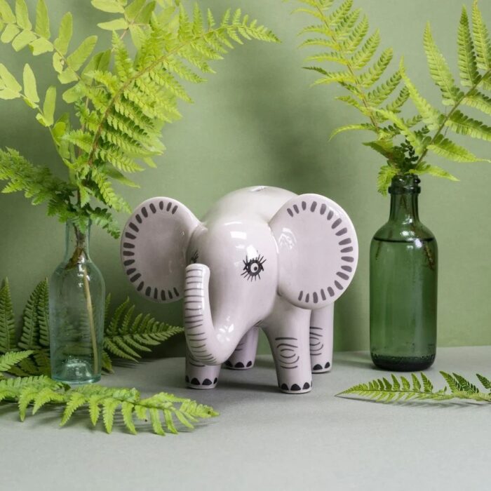 Grey ceramic money box decorated to look like an elephant
