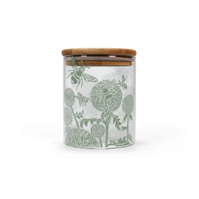 glass storage jar by kate heiss shows a glass jar with sage green decoration of bees and flower heads and a bamboo lid
