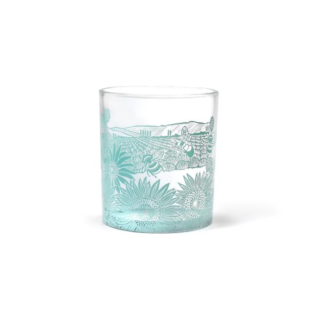 Glass tumbler powder blue shows a water glass with a blue decoration of bees and sunflowers