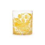 William Morris Glass Tumbler Quince shows a water glass with yellow decoration of a thrush stealing fruit in a garden