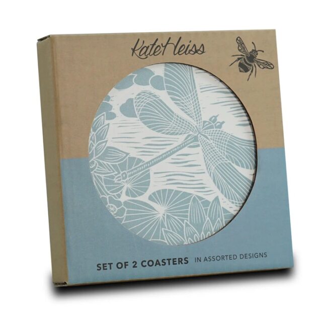 a small brown and blue box with writing on and a cut out circle on the front which shows you what's inside - a blue and white coaster with a dragonfly on it