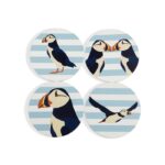 Shows four ceramic coasters with images of puffins against a blue and white background which make up the set of RSPB Ceramic Puffin Coasters