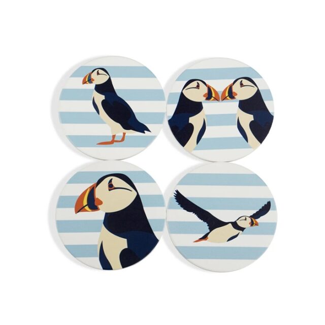 Shows four ceramic coasters with images of puffins against a blue and white background which make up the set of RSPB Ceramic Puffin Coasters