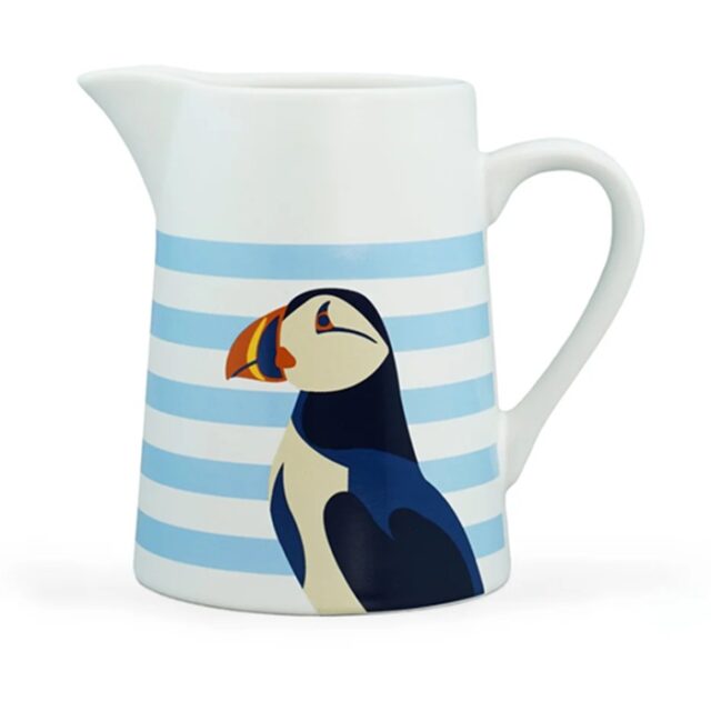 RSPB puffin jug shows a white jub with horizontal light blue stripes and a puffin's head and body in blue black and white with a colourful beak