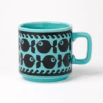 Hornsea Fish Mug in Teal by Magpie shows the blue mug with black fish designs