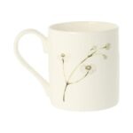 Bee mug by holly lasseter shows a delicate spray of flowers on the reverse of a white mug