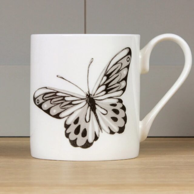Brown Butterfly Mug by Holly Lasseter image shows a sepia brown illustration of a butterfly on a white mug