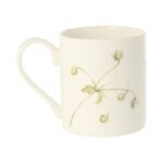 Brown Butterfly Mug by Holly Lasseter image shows a delicate pale green drawing of wild flowers on the reverse of a white mug