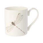 Dragonfly mug by holly lasseter shows a water colour drawing of a dragonfly in grey and black on a white mug