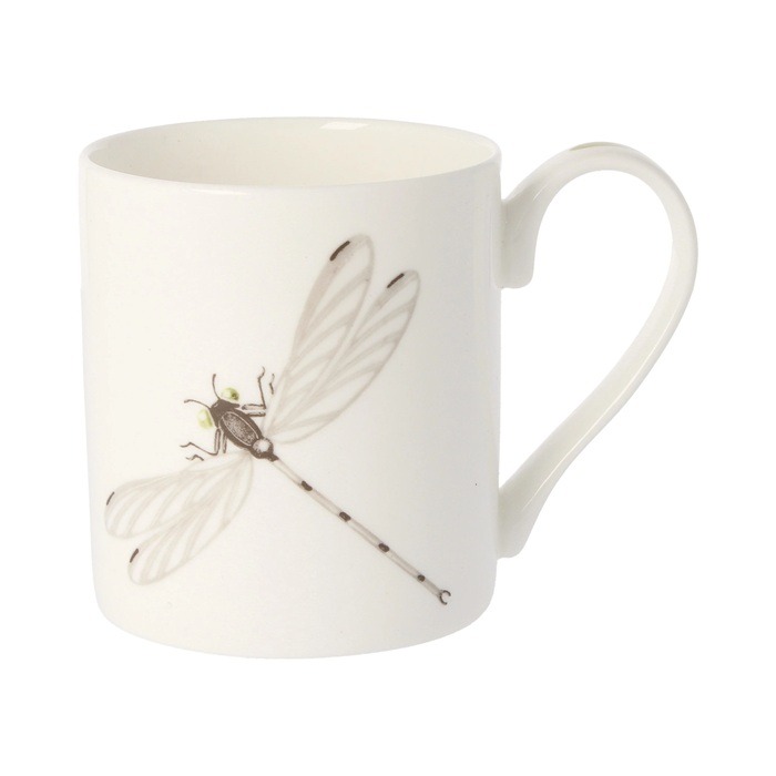 Dragonfly mug by holly lasseter shows a water colour drawing of a dragonfly in grey and black on a white mug