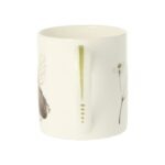 Bee mug by holly lasser shows a green leaf painted on the handle of a white mug