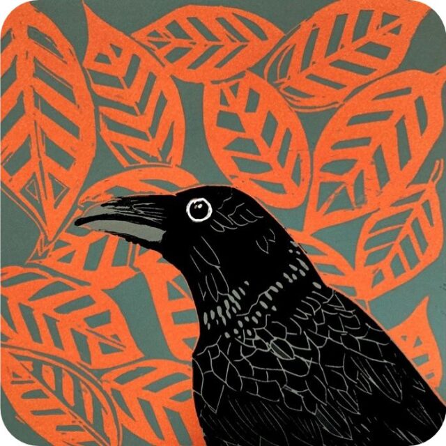 Little Crow Placemat by Sue Welfare shows a black bird with long beak and beady eye against a background of red leaves
