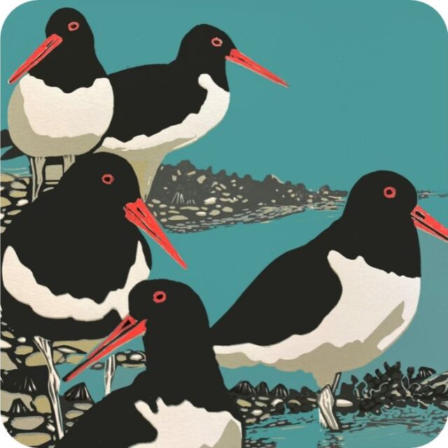 Oystercatchers Placemat by Sue Welfare shows five black and white birds with red bills on a sea shore