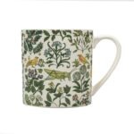 Arts and Crafts Society Grasshopper Mug shows a mug decorated with birds vegetation and a grasshopper in green against a cream background